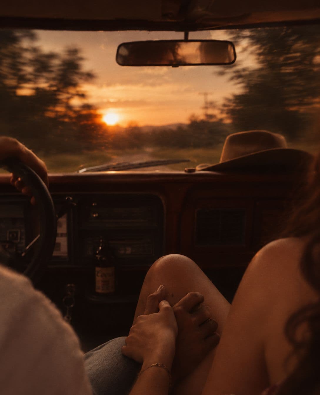 feet on the dash. the sun going down on the drive back.